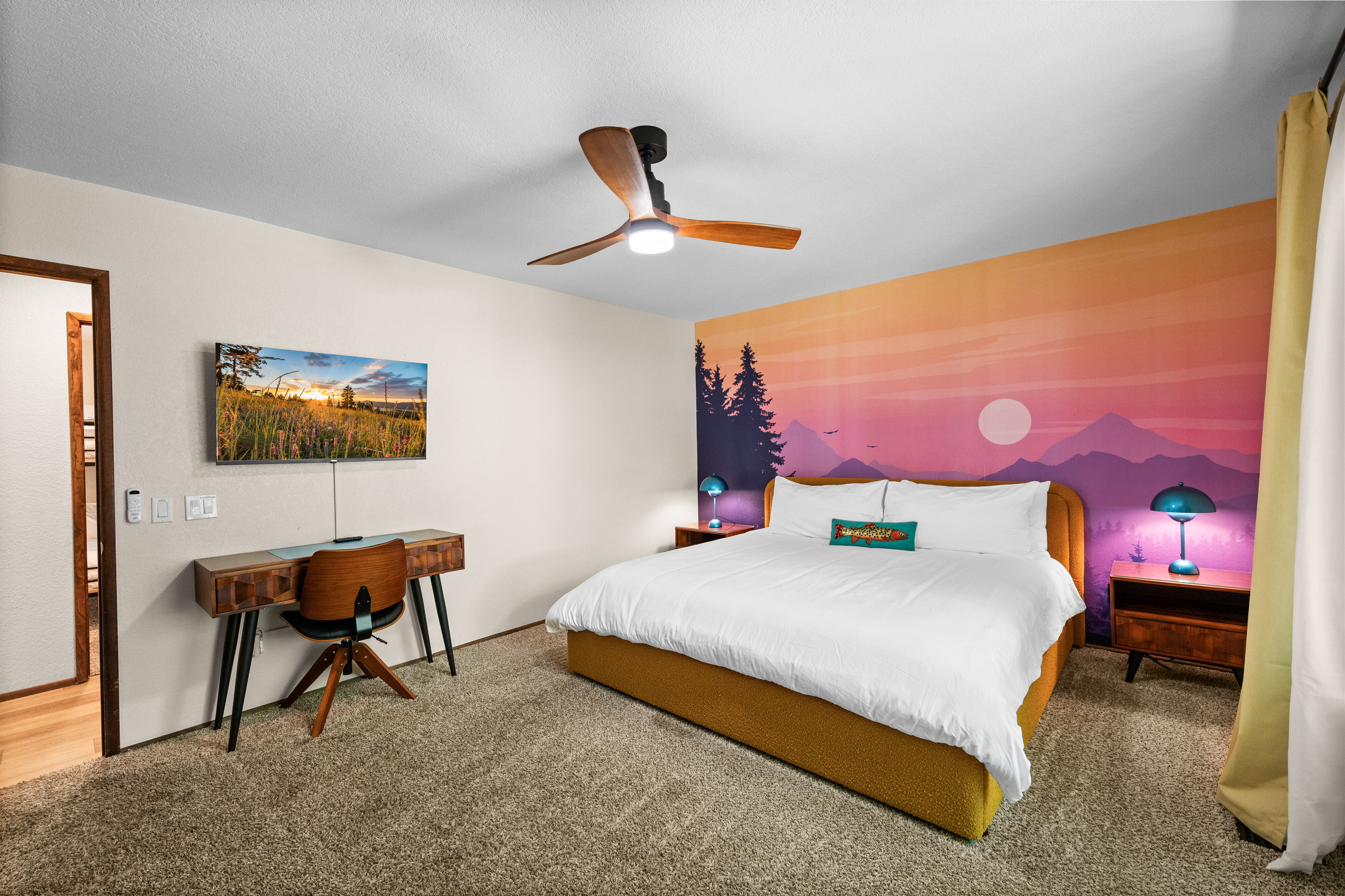 Primary king bedroom with mountain mural